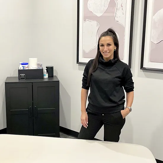 chiropractor stands in the treatment room