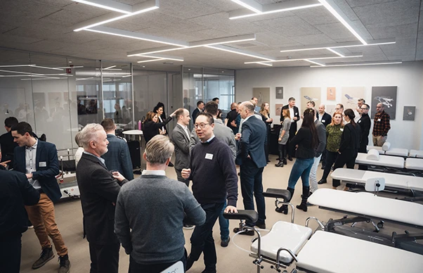 people in lively conversations in Novak M showroom