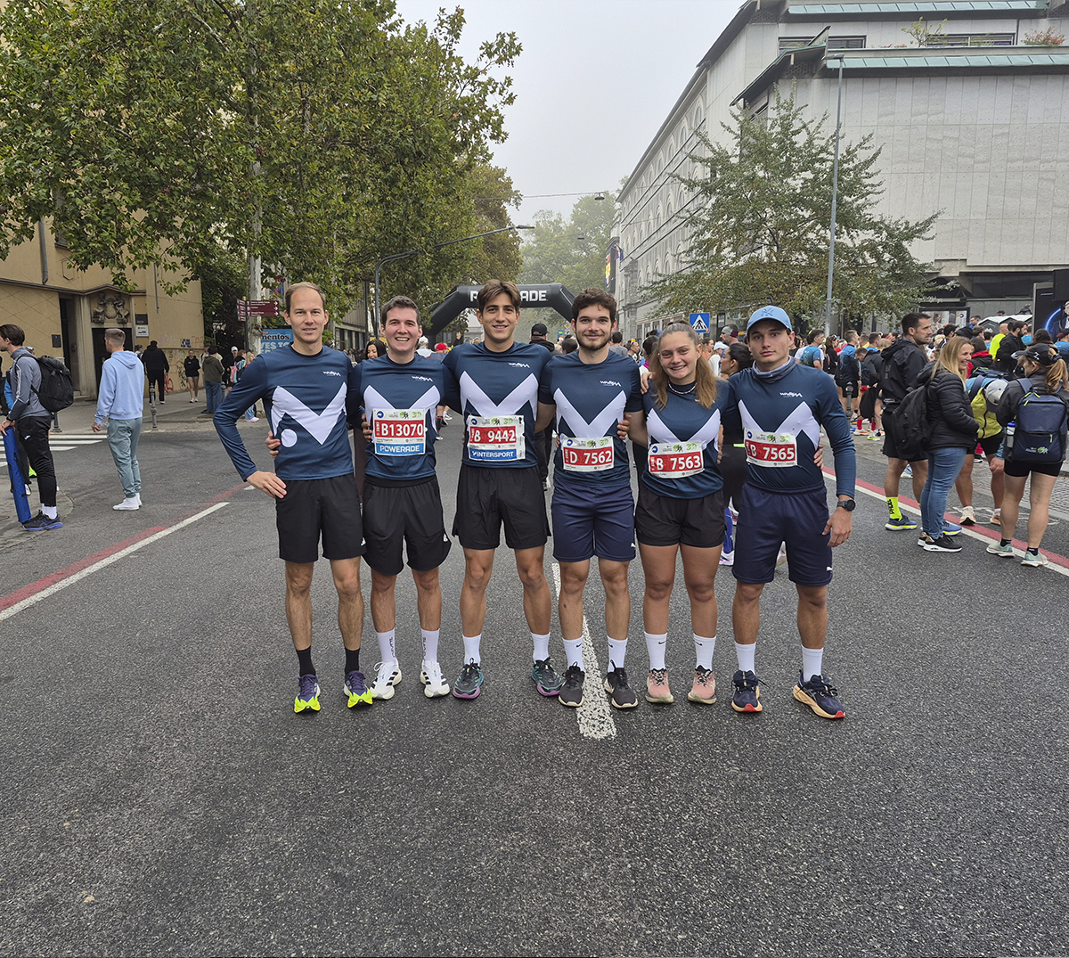 7 runners of Novak M team posing before the start of Ljubljana marathon